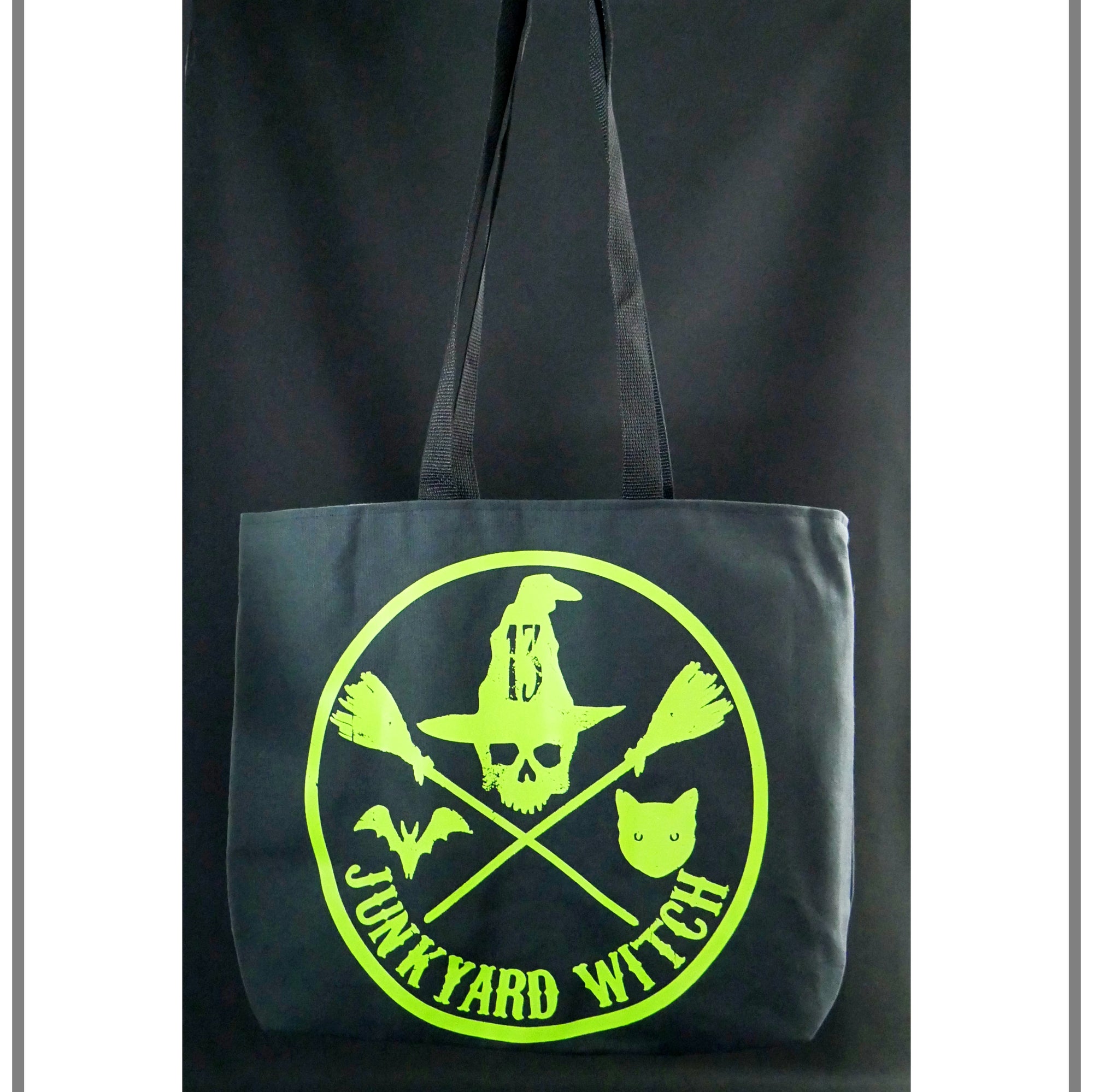 black tote with green junkyard witch skull